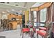 Dining area with a glass table and wooden chairs overlooking the kitchen at 226 Long Island Dr, Whitesburg, GA 30185