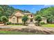 Stunning two-story home with mature landscaping, a manicured lawn, and a stately front entrance at 226 Long Island Dr, Whitesburg, GA 30185