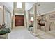 Welcoming foyer with tile floors, towering ceilings, pillars, and stylish decor at 226 Long Island Dr, Whitesburg, GA 30185