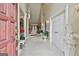 Grand foyer with soaring ceilings, elegant columns, tile flooring, and an inviting atmosphere at 226 Long Island Dr, Whitesburg, GA 30185