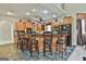 Kitchen island with wooden cabinets and six chairs at 226 Long Island Dr, Whitesburg, GA 30185