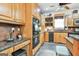 Spacious kitchen with a double oven, wood cabinets, and modern fixtures at 226 Long Island Dr, Whitesburg, GA 30185