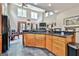 Open-concept kitchen featuring an island with bar seating and views of the dining area at 226 Long Island Dr, Whitesburg, GA 30185