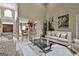 Spacious living room with high ceilings, elegant columns, and comfortable seating arrangement at 226 Long Island Dr, Whitesburg, GA 30185