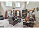 Bright living room features tall windows, a fireplace, and cozy seating at 226 Long Island Dr, Whitesburg, GA 30185