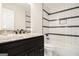 Modern bathroom featuring a stone counter, dark wood vanity, and subway tile shower at 523 Mount Zion, Hapeville, GA 30354