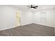 Spacious bedroom featuring a ceiling fan, wood-look floors, with entry to bathroom at 523 Mount Zion, Hapeville, GA 30354