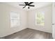 Bedroom featuring luxury vinyl plank flooring and two large windows at 523 Mount Zion, Hapeville, GA 30354