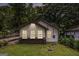 Charming bungalow featuring a well-manicured lawn and three windows that enhance the facade at 523 Mount Zion, Hapeville, GA 30354