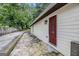 Side exterior showing siding, walkway, landscaping, and entry door at 523 Mount Zion, Hapeville, GA 30354