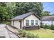 Exterior view showcasing the siding and detailed landscaping at 523 Mount Zion, Hapeville, GA 30354