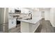 Bright kitchen featuring granite countertops, modern appliances, and white cabinetry for a contemporary feel at 523 Mount Zion, Hapeville, GA 30354