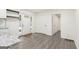 Elegant kitchen featuring white cabinetry, modern appliances, and a view of the stylish front entry door at 523 Mount Zion, Hapeville, GA 30354