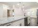 Modern kitchen featuring granite countertops, stainless appliances, and stylish pendant lighting above the island at 523 Mount Zion, Hapeville, GA 30354