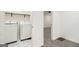 Laundry room featuring a new washer and dryer and modern tile floors at 523 Mount Zion, Hapeville, GA 30354