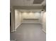 Unfinished basement area with gray painted concrete floor, ready for customization and personalization at 2360 Barrington Trace Sw Cir, South Fulton, GA 30331