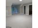 Spacious bonus room with neutral walls, plush carpet, and a window offering natural light at 2360 Barrington Trace Sw Cir, South Fulton, GA 30331