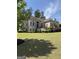 Elegant two-story home with brick facade, mature trees, and meticulously maintained lawn at 2360 Barrington Trace Sw Cir, South Fulton, GA 30331