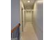 Hallway with neutral walls and carpet illuminated by recessed lighting, creating a bright and inviting space at 2360 Barrington Trace Sw Cir, South Fulton, GA 30331