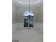 Spacious living area featuring a large window and decorative chandelier at 2360 Barrington Trace Sw Cir, South Fulton, GA 30331
