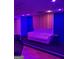 Recording studio featuring a purple lighted couch with acoustic paneling and blue walls at 2360 Barrington Trace Sw Cir, South Fulton, GA 30331