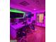 A look inside the music studio, complete with chairs, recording equipment, and colorful lighting at 2360 Barrington Trace Sw Cir, South Fulton, GA 30331