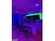 A look inside the music studio, complete with chairs, recording equipment, and colorful lighting at 2360 Barrington Trace Sw Cir, South Fulton, GA 30331