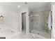 Bright bathroom featuring a glass enclosed shower with marble tiling and a single sink at 3349 Verdi Ln, Kennesaw, GA 30144