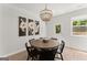 Elegant dining room featuring a round table, black chairs, and a decorative chandelier at 3349 Verdi Ln, Kennesaw, GA 30144