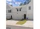 Charming townhome with a two-car garage, brick accents, and manicured lawn and welcome sign at 3349 Verdi Ln, Kennesaw, GA 30144