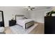 Comfortable main bedroom with a ceiling fan, a plush bed, and black nightstands at 3349 Verdi Ln, Kennesaw, GA 30144