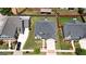 Aerial view of the property showing landscaped front yard, driveway, and roof at 675 Mallard Cv, Loganville, GA 30052