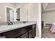 Granite bathroom counter with dual sinks and dark cabinets, offering ample counter space at 675 Mallard Cv, Loganville, GA 30052