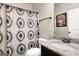 Bathroom featuring a granite vanity, toilet, and stylish shower curtain at 675 Mallard Cv, Loganville, GA 30052