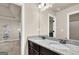 Granite bathroom counter with dual sinks and dark cabinets, offering ample counter space at 675 Mallard Cv, Loganville, GA 30052