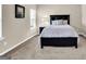 Clean and tidy bedroom showcasing a dark wood frame bed and bright window at 675 Mallard Cv, Loganville, GA 30052