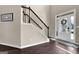 Elegant entryway featuring a staircase and hardwood floors at 675 Mallard Cv, Loganville, GA 30052