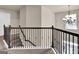 Hallway with carpet, decorative lighting and railings at 675 Mallard Cv, Loganville, GA 30052
