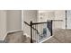 Hallway with carpet, decorative lighting and railings at 675 Mallard Cv, Loganville, GA 30052