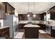Modern kitchen with stainless steel appliances and granite countertops at 675 Mallard Cv, Loganville, GA 30052