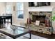 Close up of a stone fireplace and surrounding decor in the living room at 675 Mallard Cv, Loganville, GA 30052