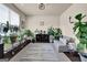 Bright living room filled with plants and natural light at 675 Mallard Cv, Loganville, GA 30052