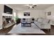 Spacious living room features a stone fireplace, large sofas, and neutral décor at 675 Mallard Cv, Loganville, GA 30052