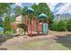 Colorful playground set with slides, climbing structures, and a mulch ground cover in community at 675 Mallard Cv, Loganville, GA 30052
