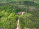 Aerial view showcasing the property boundaries and its beautiful wooded setting at 210 Short Rd, Sharpsburg, GA 30277