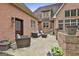 Cozy backyard patio area featuring outdoor furniture and a natural stone patio at 210 Short Rd, Sharpsburg, GA 30277