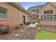 A hardscaped backyard featuring outdoor seating, patio and manicured mulched garden at 210 Short Rd, Sharpsburg, GA 30277