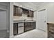 Basement bar with wine storage and a granite countertop at 210 Short Rd, Sharpsburg, GA 30277