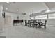 Spacious basement dining area with carpet, natural light, chandelier, and a buffet cabinet at 210 Short Rd, Sharpsburg, GA 30277