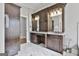 Primary bathroom showcasing dual vanities with granite countertops and dark wood cabinetry at 210 Short Rd, Sharpsburg, GA 30277